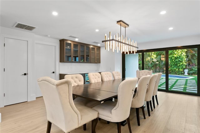 dining room with recessed lighting, visible vents, a chandelier, and light wood-type flooring