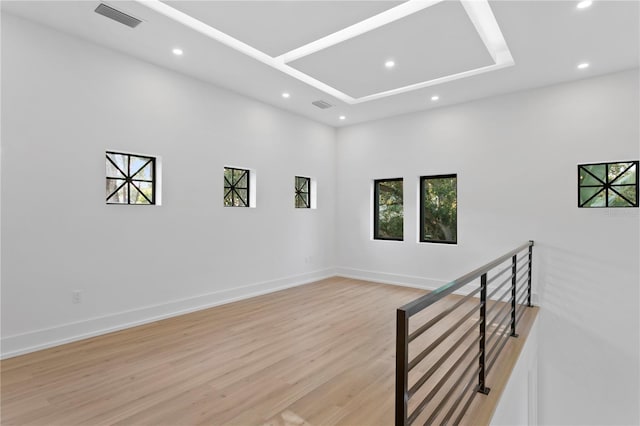 unfurnished room featuring visible vents, recessed lighting, light wood-style floors, and baseboards