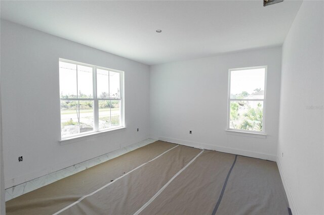 empty room featuring a wealth of natural light