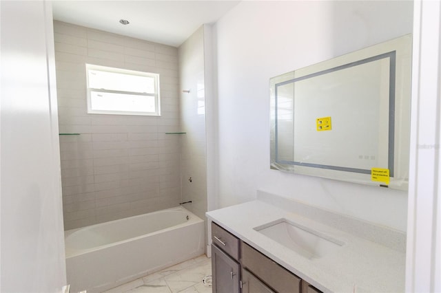 bathroom with marble finish floor, shower / tub combination, and vanity