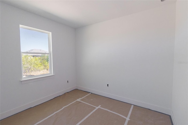 empty room featuring baseboards