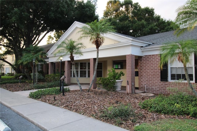 view of front of property featuring brick siding