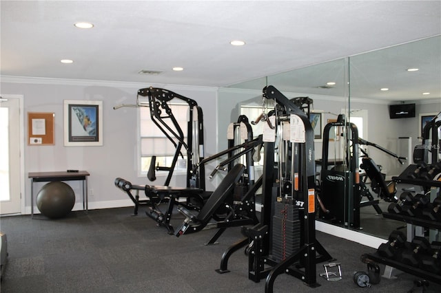 exercise room with baseboards, recessed lighting, visible vents, and crown molding