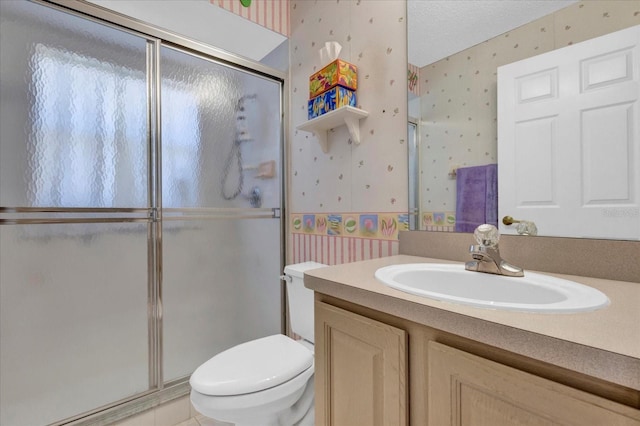 full bathroom with wallpapered walls, a shower stall, and a textured ceiling