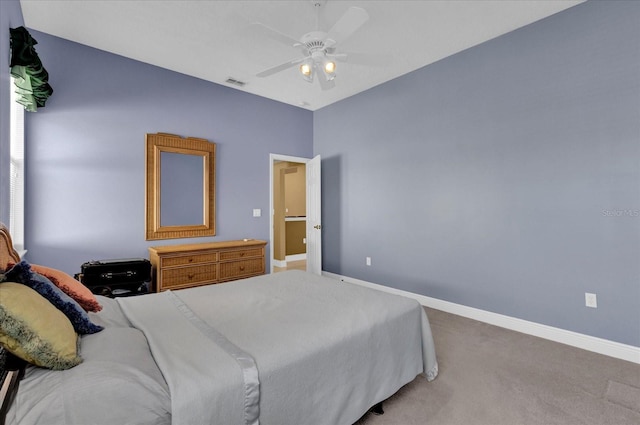 carpeted bedroom featuring ceiling fan, visible vents, and baseboards