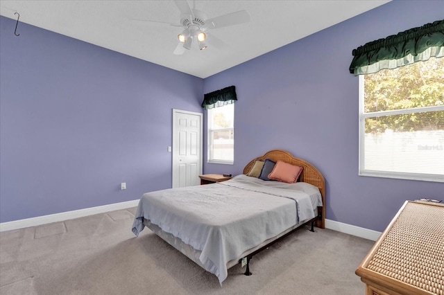 bedroom featuring carpet, baseboards, and ceiling fan