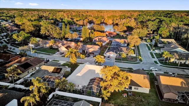 bird's eye view featuring a water view, a forest view, and a residential view