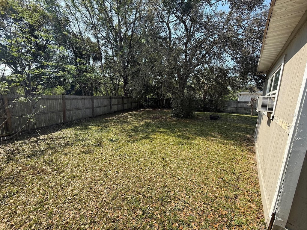 view of yard with a fenced backyard