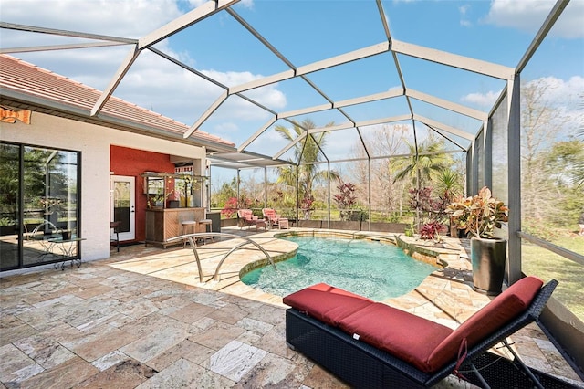 pool featuring a lanai and a patio area