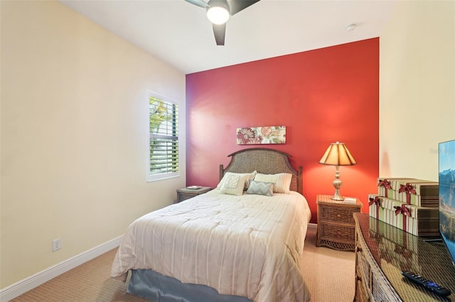 bedroom featuring baseboards, carpet, and a ceiling fan