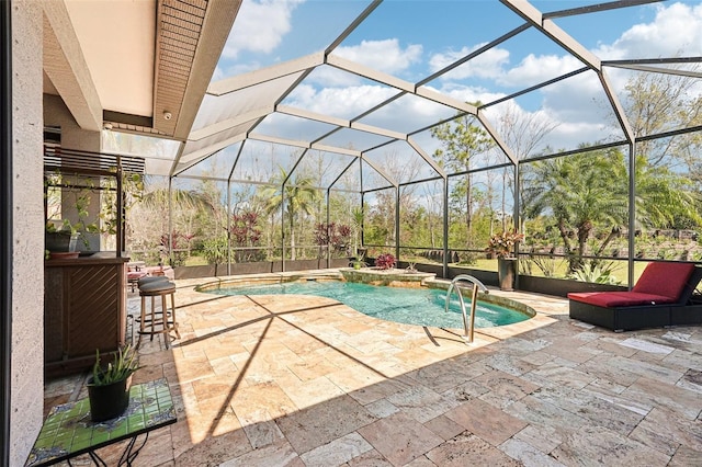 pool with a patio area and glass enclosure