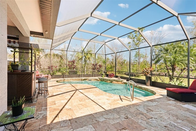 pool with glass enclosure, a jacuzzi, and a patio