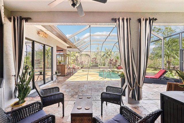 view of patio with a lanai, an outdoor pool, an outdoor living space, and ceiling fan