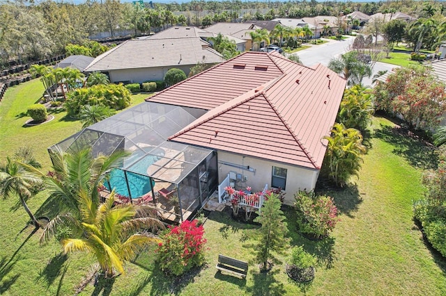 birds eye view of property with a residential view