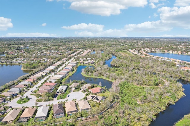 bird's eye view featuring a residential view and a water view