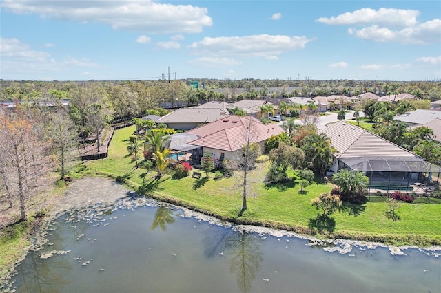 bird's eye view featuring a residential view and a water view