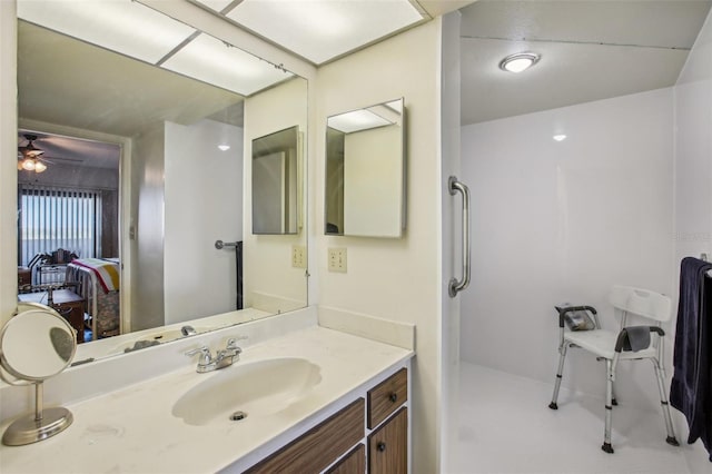 bathroom featuring a ceiling fan, vanity, and ensuite bathroom