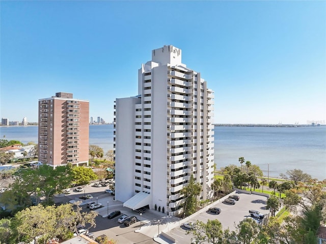 view of property with a view of city and a water view