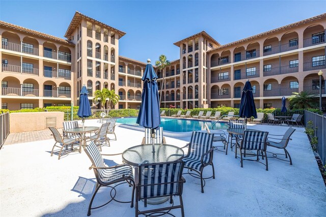 view of patio with a community pool