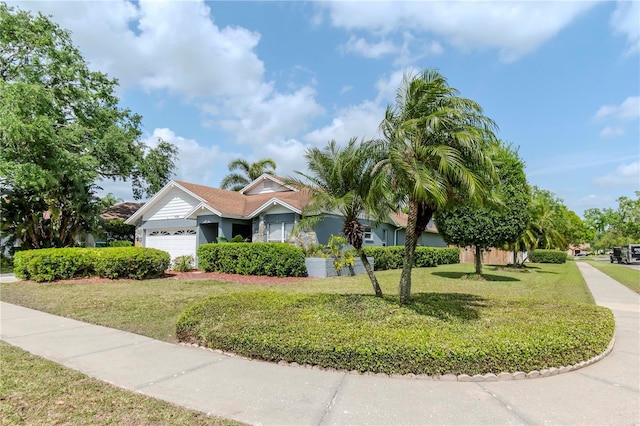 14501 Brambie Ct, Tampa, FL 33624 - view of front of property with a front lawn and an attached garage
