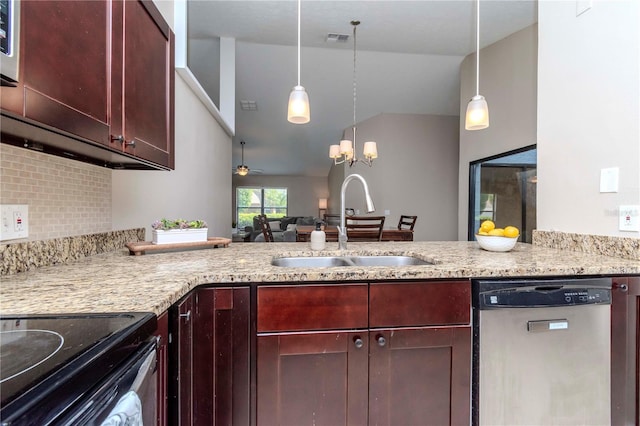 14501 Brambie Ct, Tampa, FL 33624 - kitchen with a sink, light stone counters, dishwasher, and a peninsula