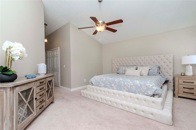 14501 Brambie Ct, Tampa, FL 33624 - bedroom with a ceiling fan, light carpet, baseboards, and vaulted ceiling
