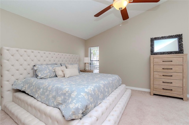 14501 Brambie Ct, Tampa, FL 33624 - bedroom featuring light carpet, baseboards, vaulted ceiling, and ceiling fan