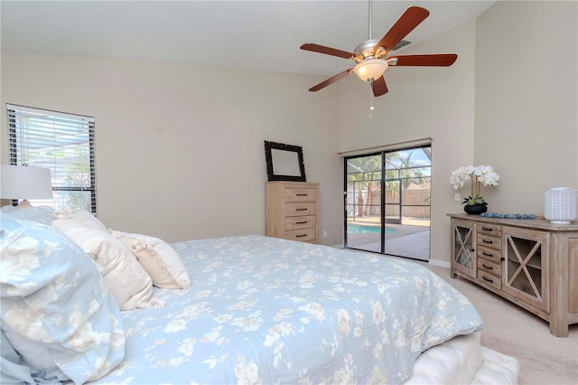 14501 Brambie Ct, Tampa, FL 33624 - bedroom featuring high vaulted ceiling, ceiling fan, access to outside, and light colored carpet