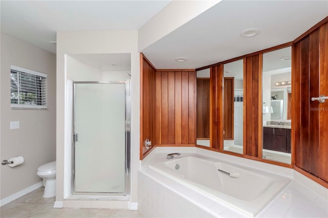 14501 Brambie Ct, Tampa, FL 33624 - full bathroom featuring toilet, vanity, a shower stall, tile patterned flooring, and a bath