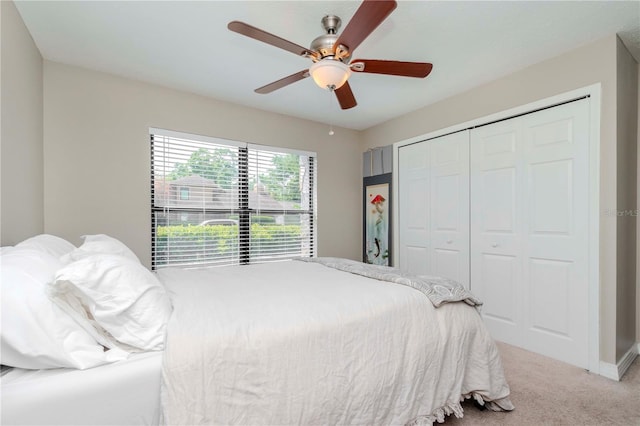 14501 Brambie Ct, Tampa, FL 33624 - bedroom featuring baseboards, a closet, carpet floors, and a ceiling fan