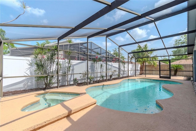 14501 Brambie Ct, Tampa, FL 33624 - view of swimming pool featuring glass enclosure, a fenced backyard, and a patio area
