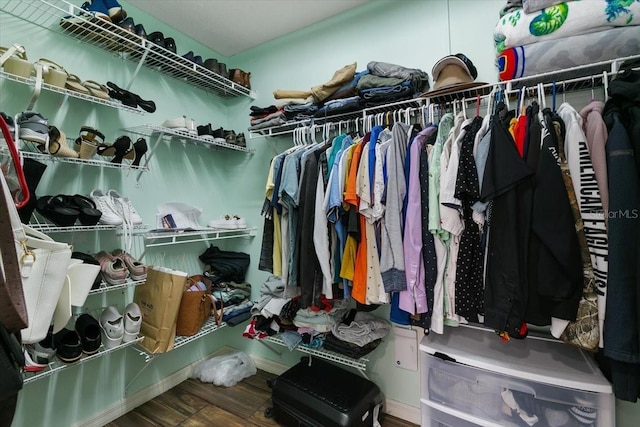 spacious closet featuring wood finished floors