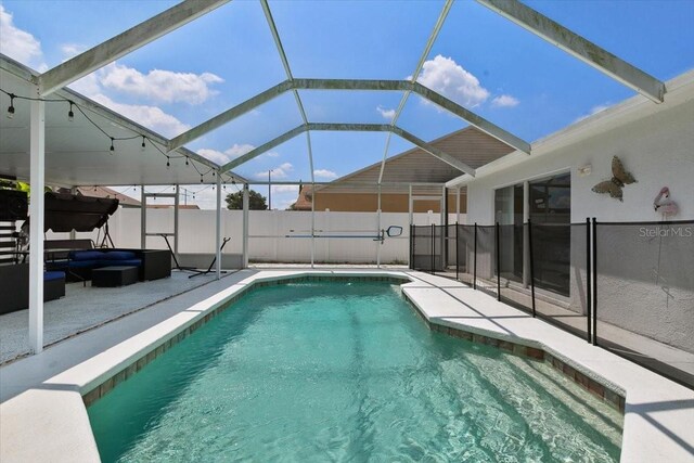 view of pool with a patio, a lanai, a fenced in pool, and fence