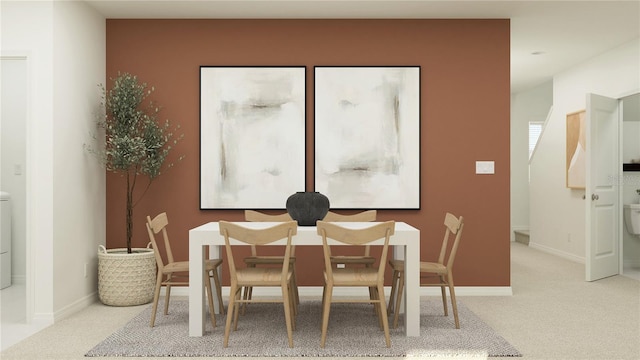 dining area with carpet floors and baseboards