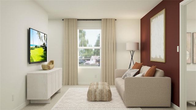 living area with light colored carpet and baseboards