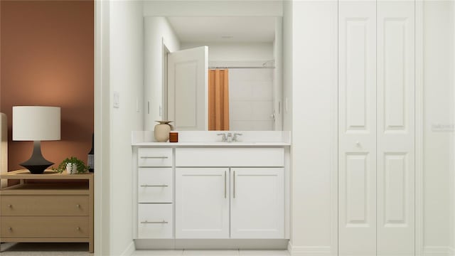 bathroom featuring a shower with shower curtain, a closet, and vanity