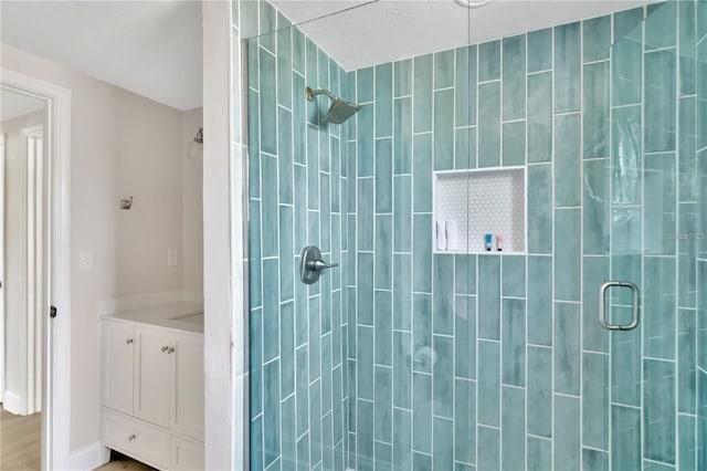 full bath featuring a shower stall and vanity