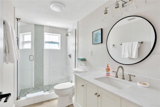 bathroom featuring a stall shower, visible vents, vanity, and toilet