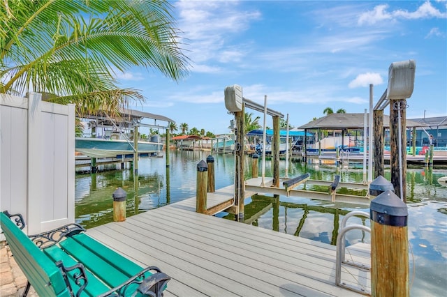 view of dock with a water view and boat lift