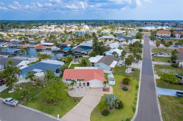 birds eye view of property featuring a residential view and a water view