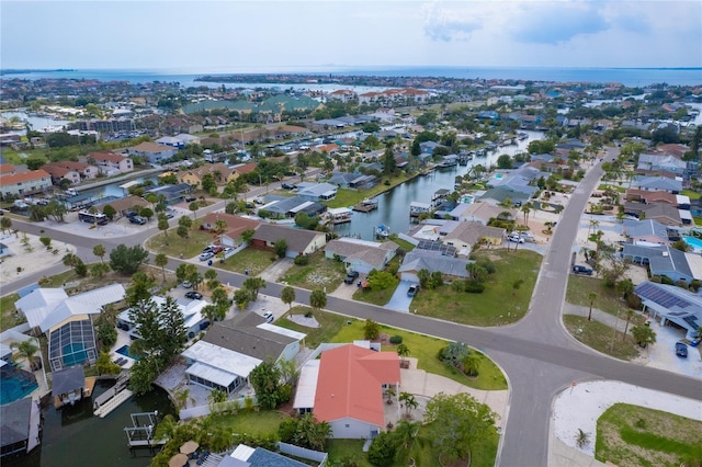 aerial view with a water view and a residential view