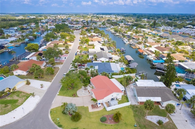 birds eye view of property featuring a residential view and a water view