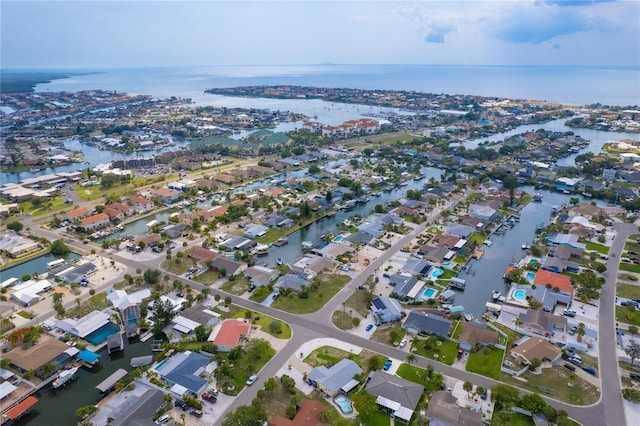 birds eye view of property with a residential view and a water view