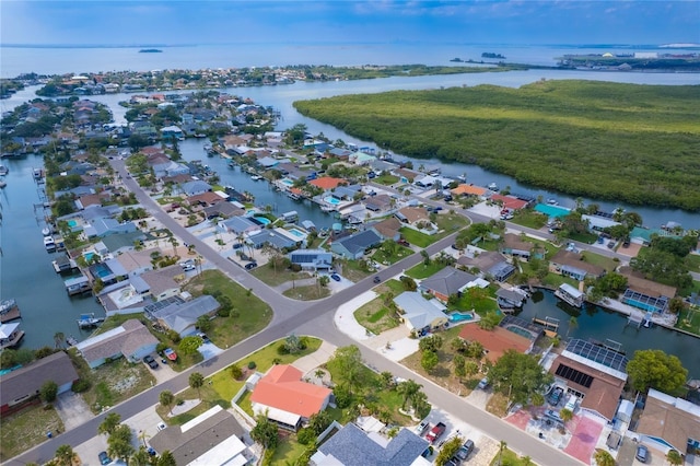 drone / aerial view with a water view and a residential view