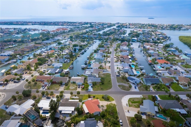 bird's eye view with a water view and a residential view