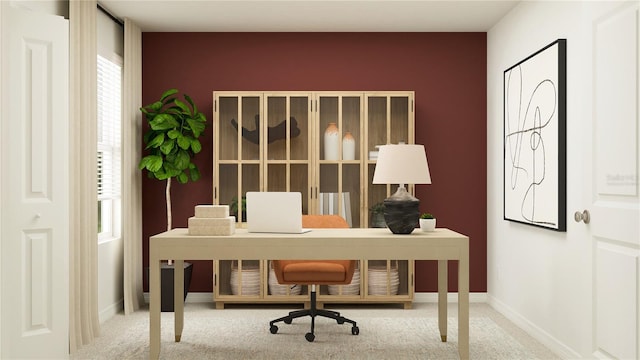 office space with carpet and baseboards