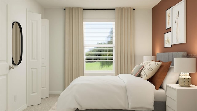 bedroom with multiple windows, light carpet, and baseboards