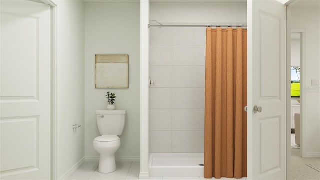 full bath featuring toilet, a shower stall, baseboards, and tile patterned floors