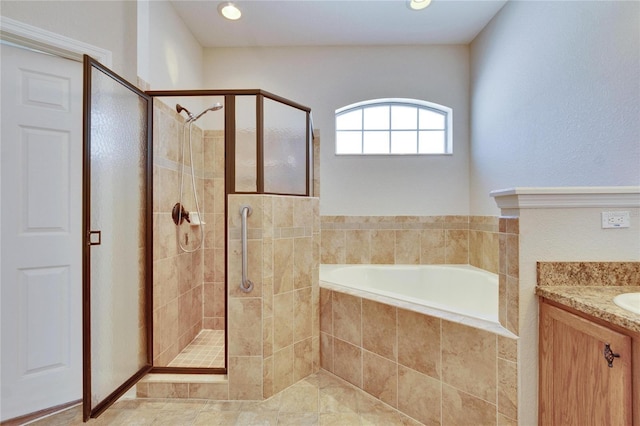 full bathroom featuring recessed lighting, a shower stall, vanity, and a bath