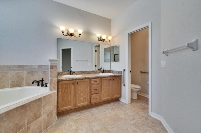 full bathroom with toilet, double vanity, a sink, and a bath